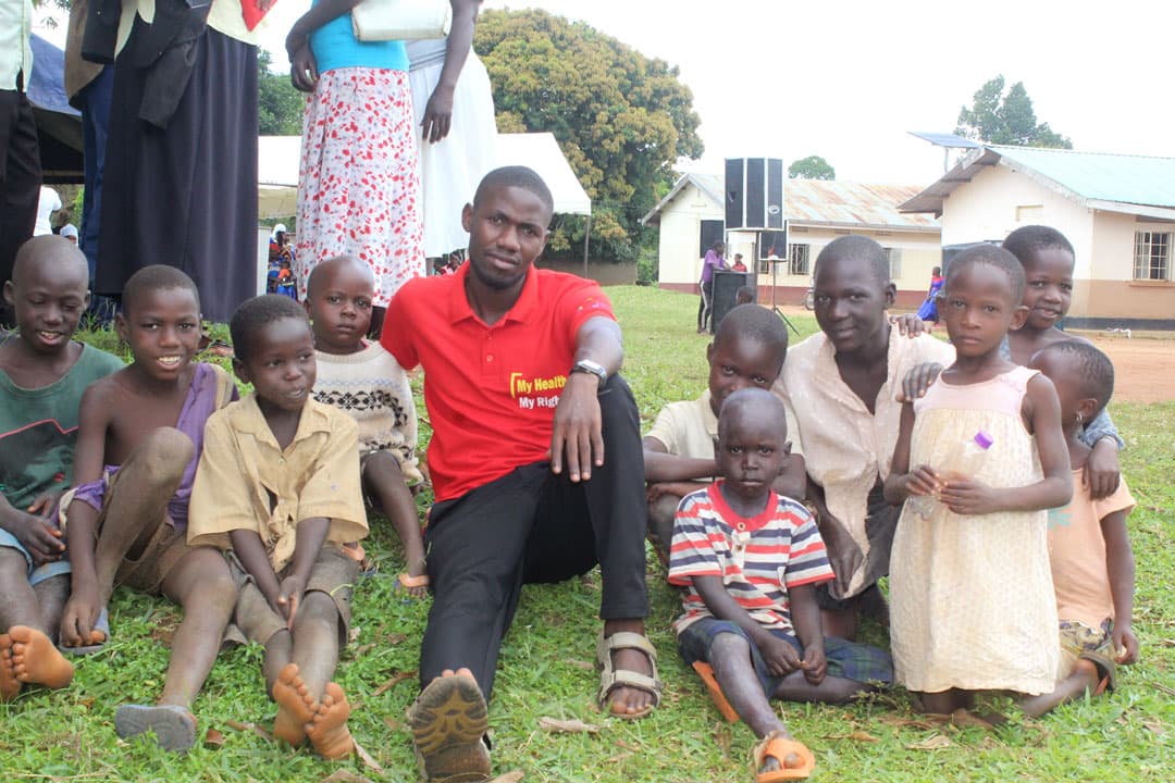 A child smiling in a community setting