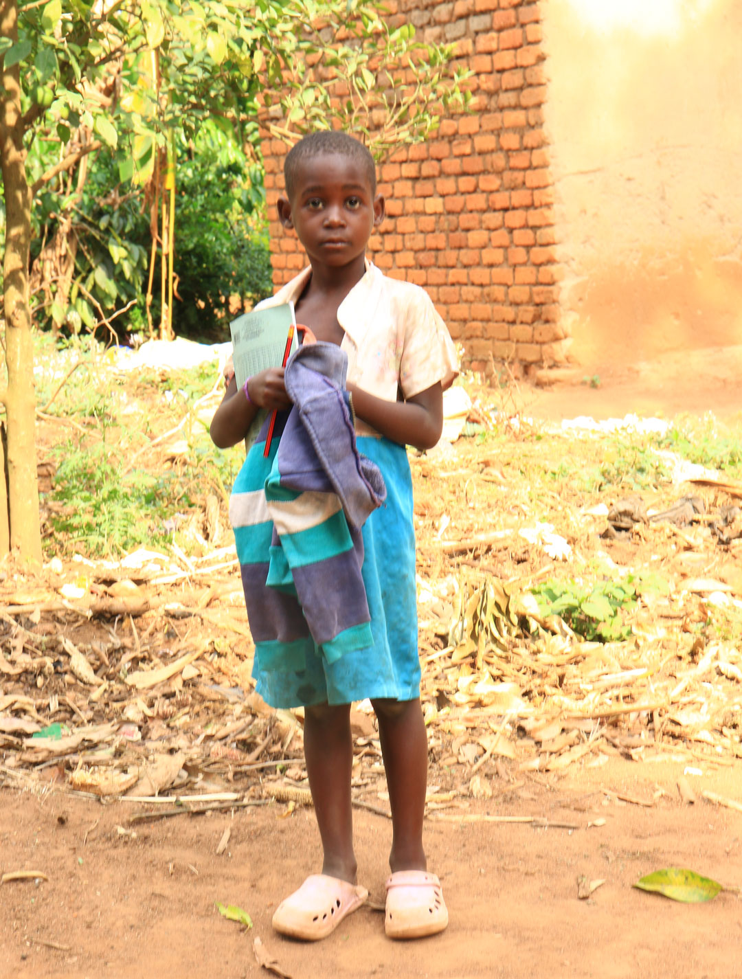 A volunteer helping a child with their schoolwork