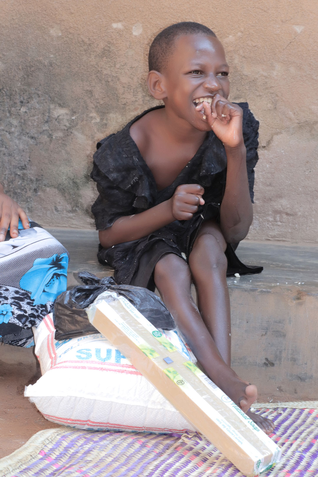 A volunteer helping a child with their schoolwork