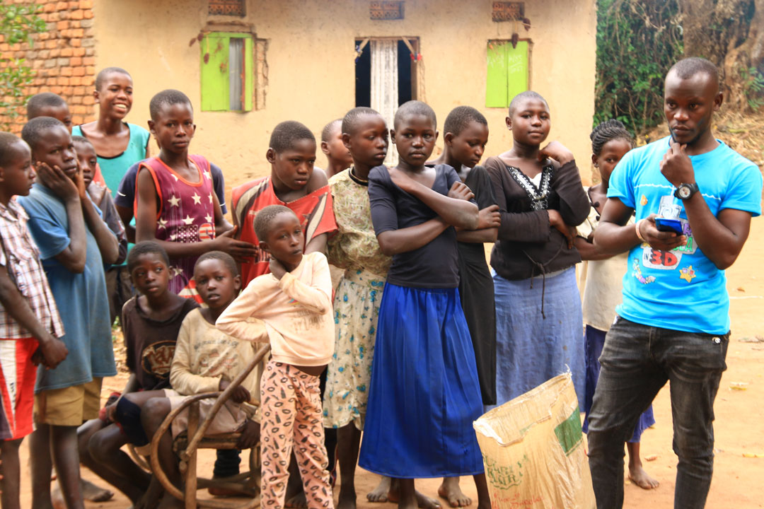 Youth playing soccer in a SALIFU program